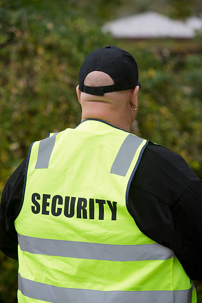 overweight-security-guard-with-a-walkie-talkie-picture-id155439441